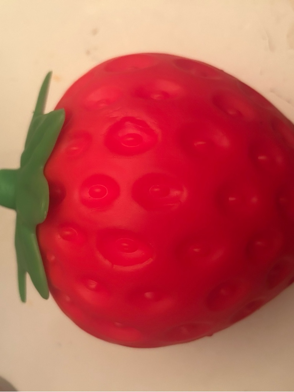 Red Strawberry Toy with Green Leaf Accent